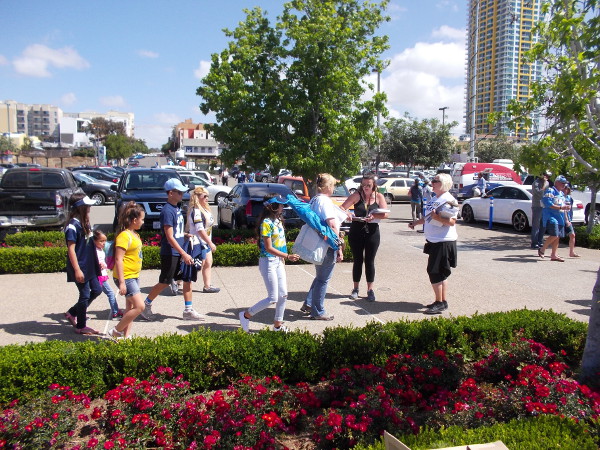 People arriving at the San Diego Chargers downtown stadium petition drive event are asked to add their signatures.