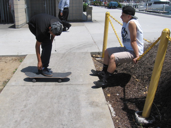 Skaters take a break in the sunshine near Tuna Harbor.