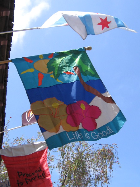 Colorful banner fluttering in the sea breeze proclaims Life is Good. I always enjoy walking past Alamo Flags in Seaport Village.