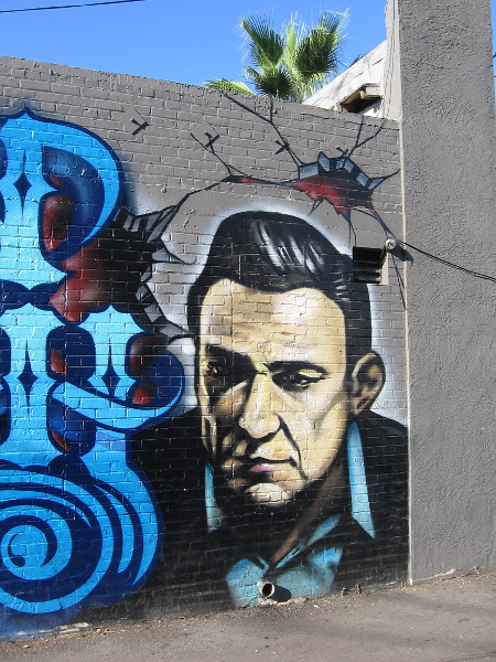 The face of Johnny Cash spray painted in Ocean Beach.