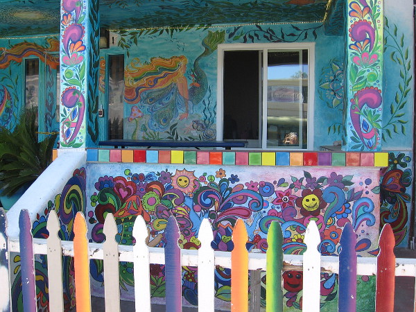 The exterior of USA Hostels Ocean Beach is absolutely covered with colorful psychedelic artwork.