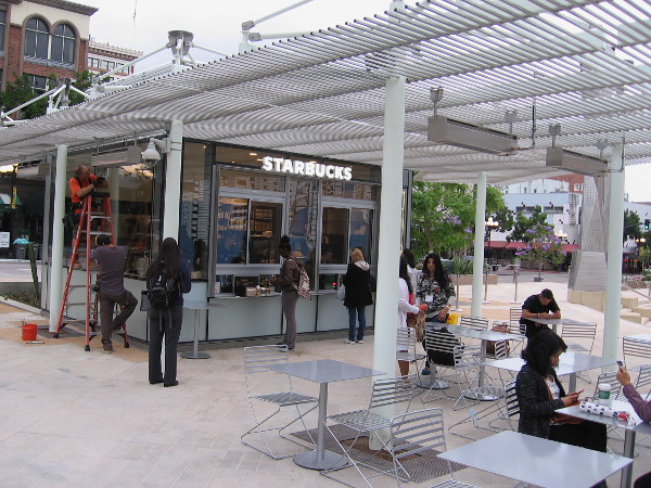 Starbucks occupies one of three food pavilions at the new Horton Plaza Park. The morning after the park's grand opening, this Starbucks is already busy.