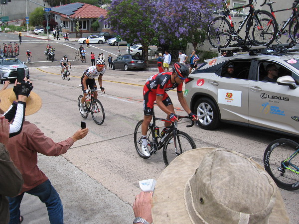Some cyclists at the end of the main group were intermixed with team support vehicles.