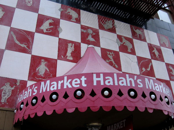 Halah's Market in downtown San Diego has a storefront with some amazing old circus artwork. After a little searching, I found nothing about the history of this building.