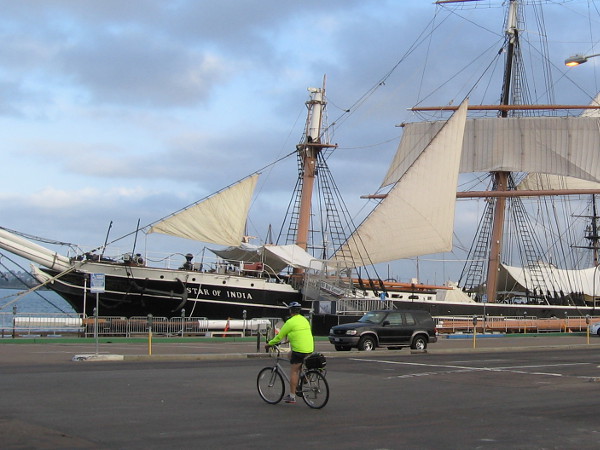 Someone pedals past San Diego's historic tall ship Star of India. Another beautiful morning.