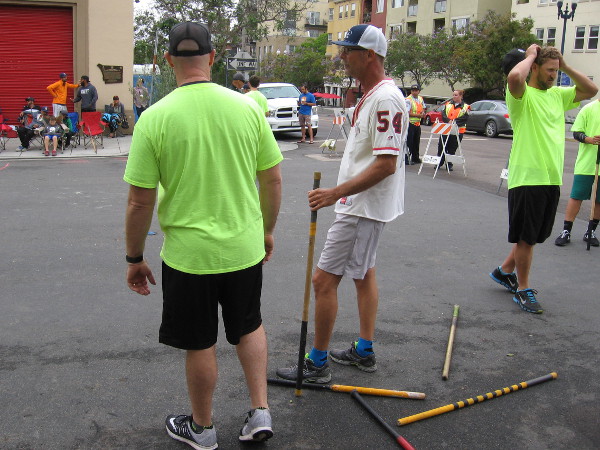 Players prepare to go to bat during a stickball tournament in San Diego's Little Italy.