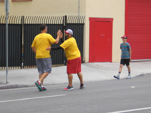 Encouragement and friendship on the streets of San Diego.