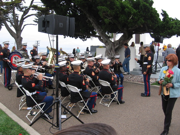 The ceremony is over, and those visiting the cemetery fan out to pay their respects. The Marine Band remained seated for a bit of concluding music.