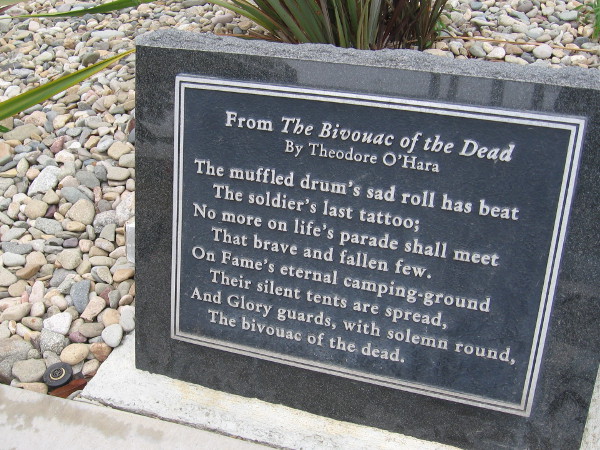 Plaque near Fort Rosecrans National Cemetery entrance has lines from The Bivouac of the Dead, a poem by Theodore O'Hara.