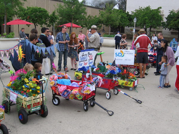 Looks like parade participants had lots of fun decorating their flower-laden wagons!