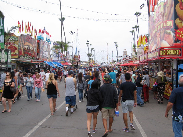 Walking down the good old midway. Once known as the Del Mar Fair, the county fair is a wildly popular summer attraction in Southern California.