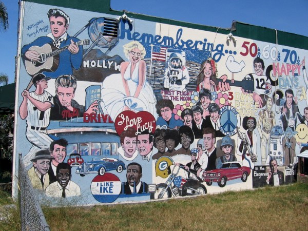 A super cool street mural in North Park depicts icons from three decades: the 50s, 60s and 70s.
