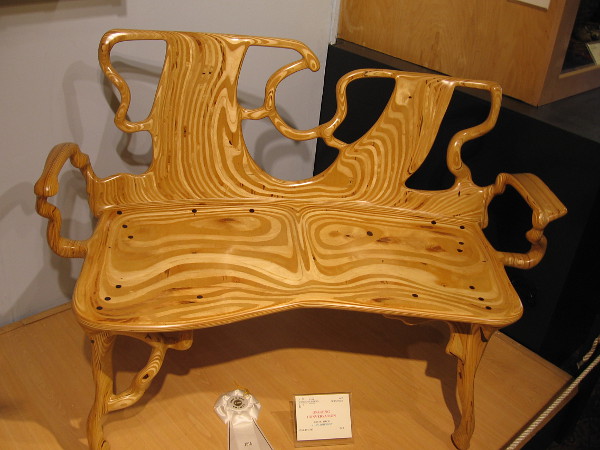 Wood grains flow in this crazy organic bench. Ongoing Conversation, Baltic Birch, Alan Johnson.