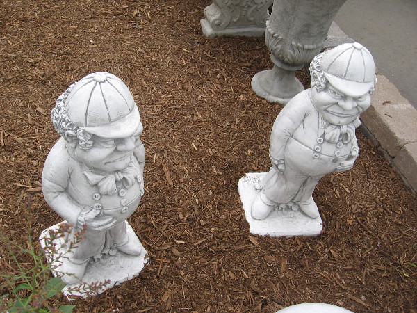 It's Tweedledum and Tweedledee. They're from the sequel to Lewis Carroll's Alice's Adventures in Wonderland, the equally classic Through the Looking-Glass.