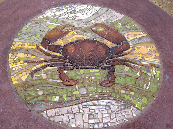 A crab is featured in this colorful mosaic of ceramic tiles.