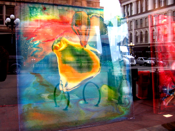 Abstract art melds with cars, buildings, and bits of everyday experience in one wonderful window.