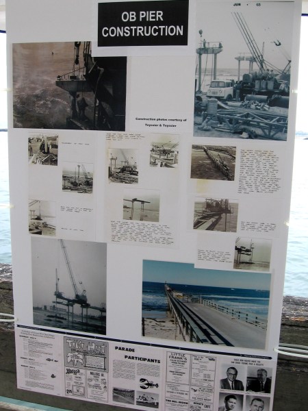Poster shows photos of the OB Pier construction back in the 1960s. 2 foot diameter piles were place 12 feet deep into bedrock. Slabs placed on top were welded securely.