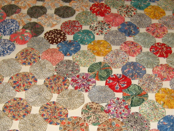 Some colorful fabric circles arranged on a table.