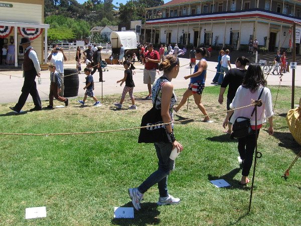 A cakewalk. Stop on the winning number and you receive a cake! This game was common in mid 19th century San Diego.