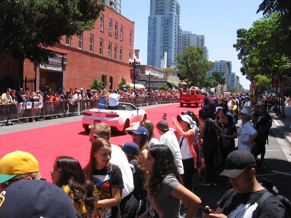 The first couple vehicles in the parade have passed. I've taken position next to the red carpet in San Diego's historic Gaslamp Quarter.