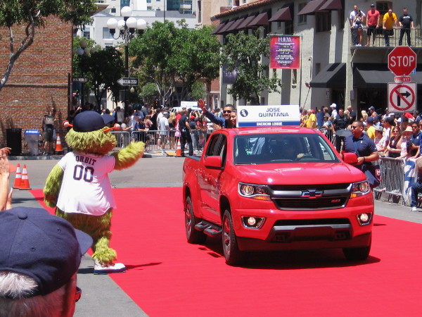 Orbit, the crazy mascot of the Houston Astros, greets Jose Quintana of the Chicago White Sox.