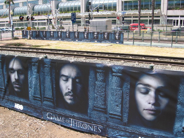Several banners along the trolley tracks promote the newest season of Game of Thrones.