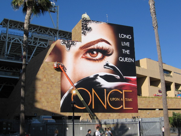 Another huge wrap being applied to a section of Petco Park promotes Once Upon A Time.