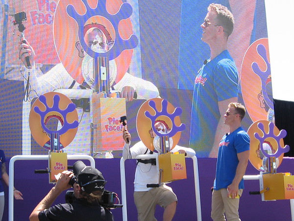 Lots of people were being videoed while playing Pie Face, which is a Hasbro game. Most every face ended up with whipped cream.