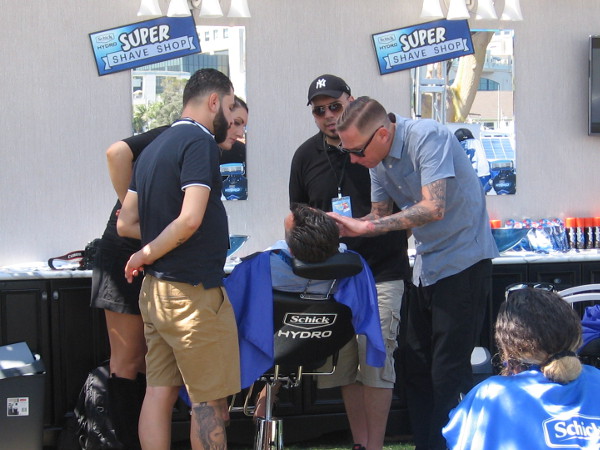 Schick is at Con-X giving free shaves. Now that is some close attention!