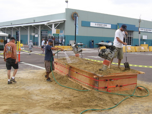 Getting ready for the 2016 US Sand Sculpting Challenge and 3D Art Expo at the B Street Pier. A sand sculpture will soon rise here to welcome Labor Day crowds along the Embarcadero.