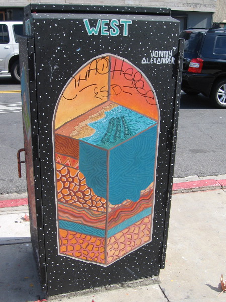 One unique utility box has four sides featuring subterranean slices. West shows where land meets Pacific Ocean.