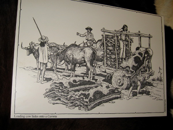 Illustration of loading cow hides onto a carreta. Hides were gathered by ships along the coast to be transported around Cape Horn to the eastern United States.