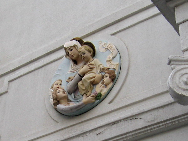 Mary and Christ Child welcome the faithful above the entrance to Our Lady of the Rosary church.