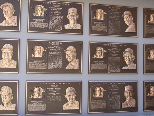 A wall at Petco Park is dedicated to Padres coaches and players who are now in the National Baseball Hall of Fame. Names include Rollie Fingers, Ozzie Smith, Rickey Henderson, Goose Gossage.
