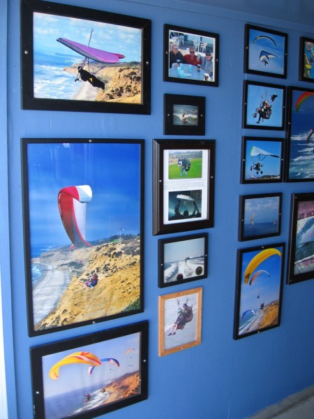 A short hallway that leads into the Torrey Pines Gliderport store features many photos of past hang gliding and paragliding action.