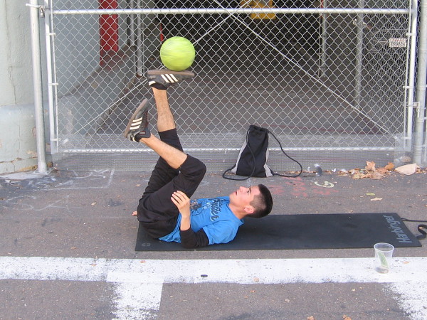 Street performer balances a ball at Navy Pier.
