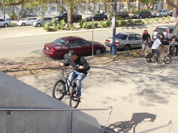 A bicyclist with a daring spirit at the Harbor Drive pedestrian bridge.