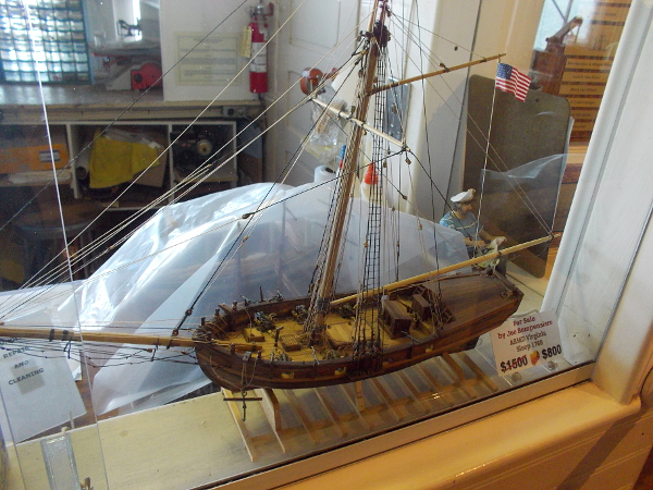 A finished model of ARMD Virginia Sloop 1768 intricately made to replicate an actual historical vessel.