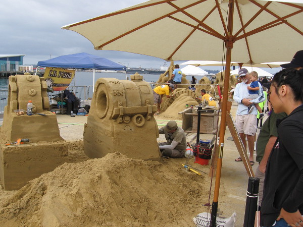 Looking down the length of the B Street Pier near the San Diego Cruise Ship Terminal. These artists you see are some teams representing the Cool California Carvers.