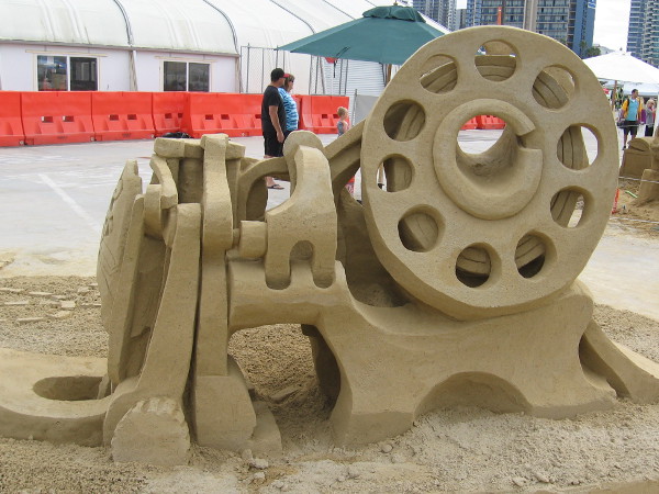 The Rockin' Bobbin, which resembles a machine with many parts, is a wonderful example of complex sand art.