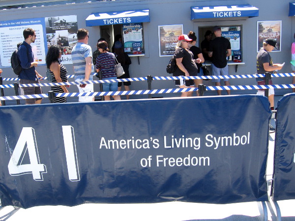 People buy tickets to board the USS Midway Museum. The aircraft carrier turned 71 years old today. It has become one of San Diego's top attractions.