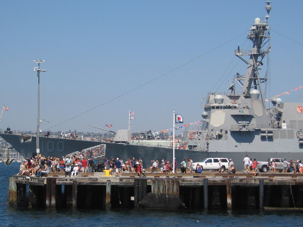 Lots of people watch the action on San Diego Bay from the end of the Broadway Pier. USS Kidd is in the background, hosting public tours from the B Street Pier.