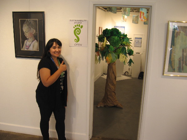 Ruby welcomes visitors into the Sustainability Studio, where one can learn about the conservation efforts of various organizations in Balboa Park.