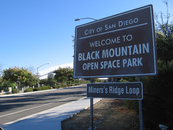 To find the trailhead for the Trail For All People, turn off of Carmel Valley Road at this sign, just south of the traffic light at Valle Del Sur Court.