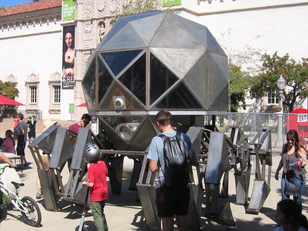 A huge spider-like working octopod vehicle on display in the Plaza de Panama at 2016 Maker Faire San Diego!