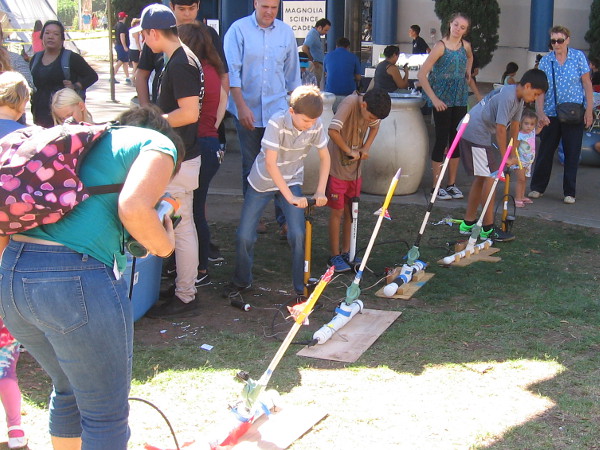 Kids have a blast in front of the San Diego Air and Space Museum. Air-propelled rockets were flying all over the place.