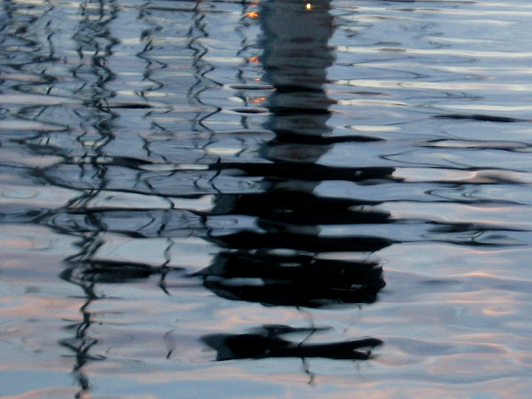 A mysterious reflection in the rippled water.