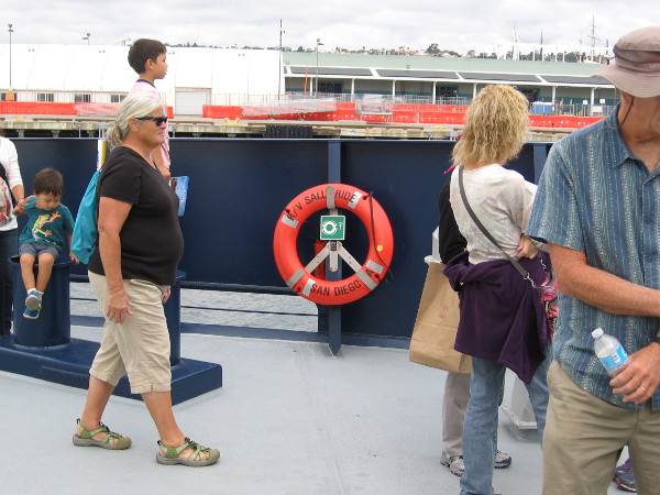 An orange life ring reads RV Sally Ride, San Diego.