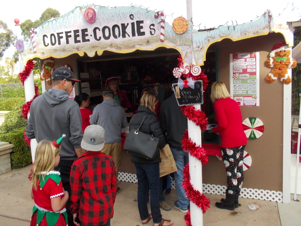 A shack magically transported from the North Pole provides treats at the Spreckels Organ Pavilion during Christmas on the Prado.