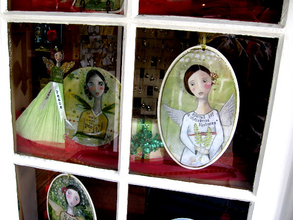 Christmas angels peer out of a window at Silver Crossing in Seaport Village.